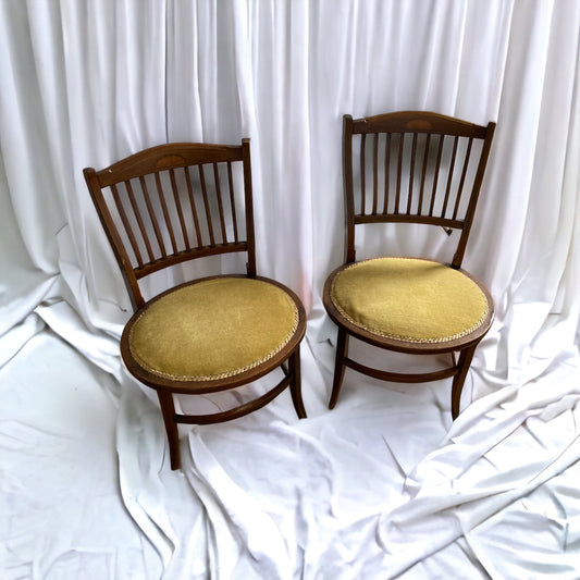 A pair of Edwardian Antique Mahogany Oval based hall chairs