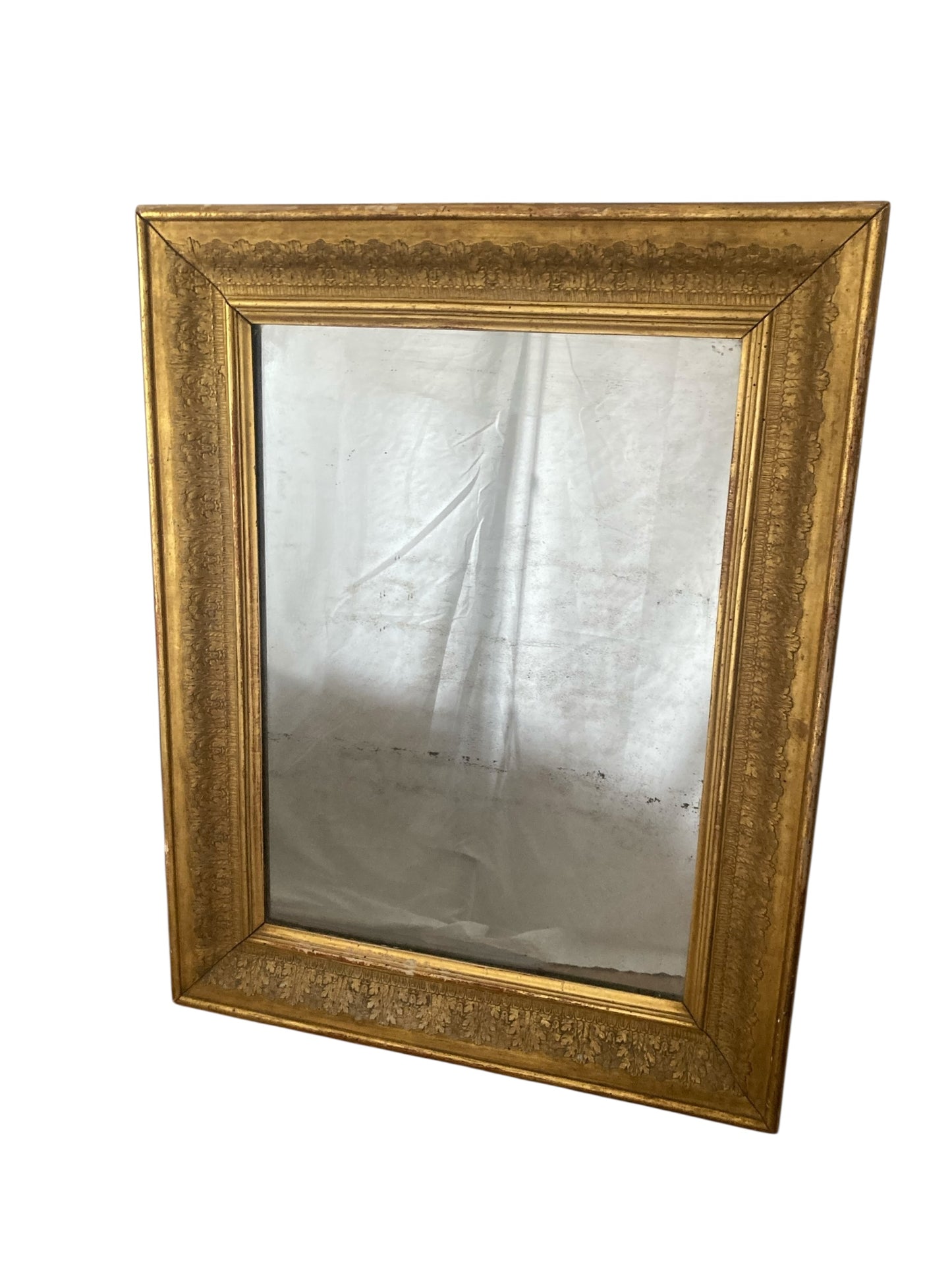 Victorian gilt wall mirror the frame decorated with moulded gold foliate patterns