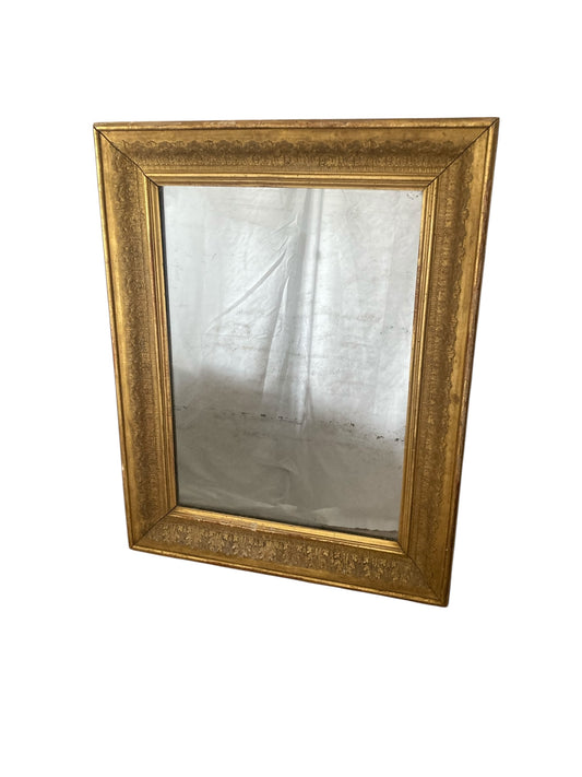 Victorian gilt wall mirror the frame decorated with moulded gold foliate patterns