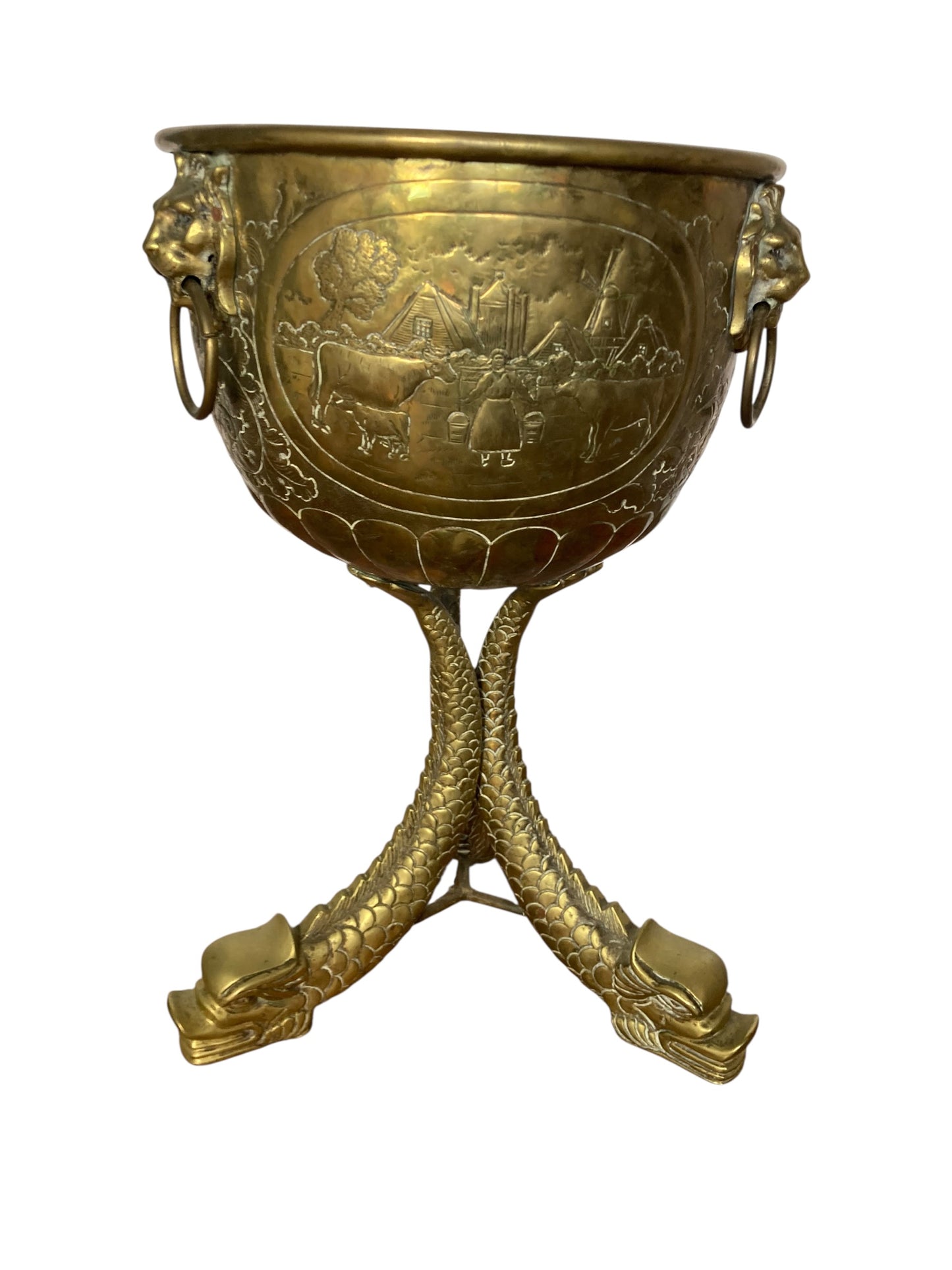 An antique brass jardinière or decorative planter