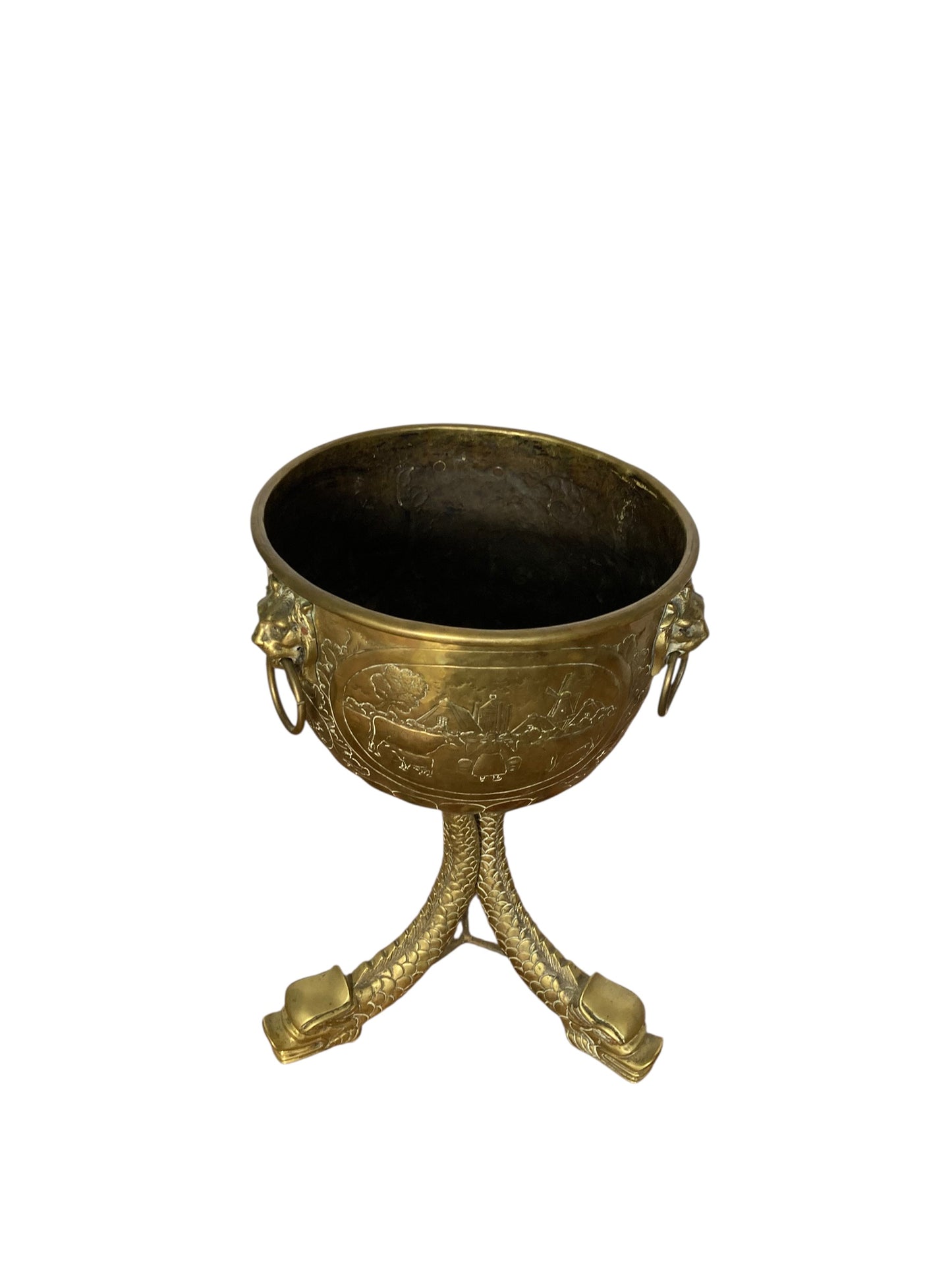 An antique brass jardinière or decorative planter