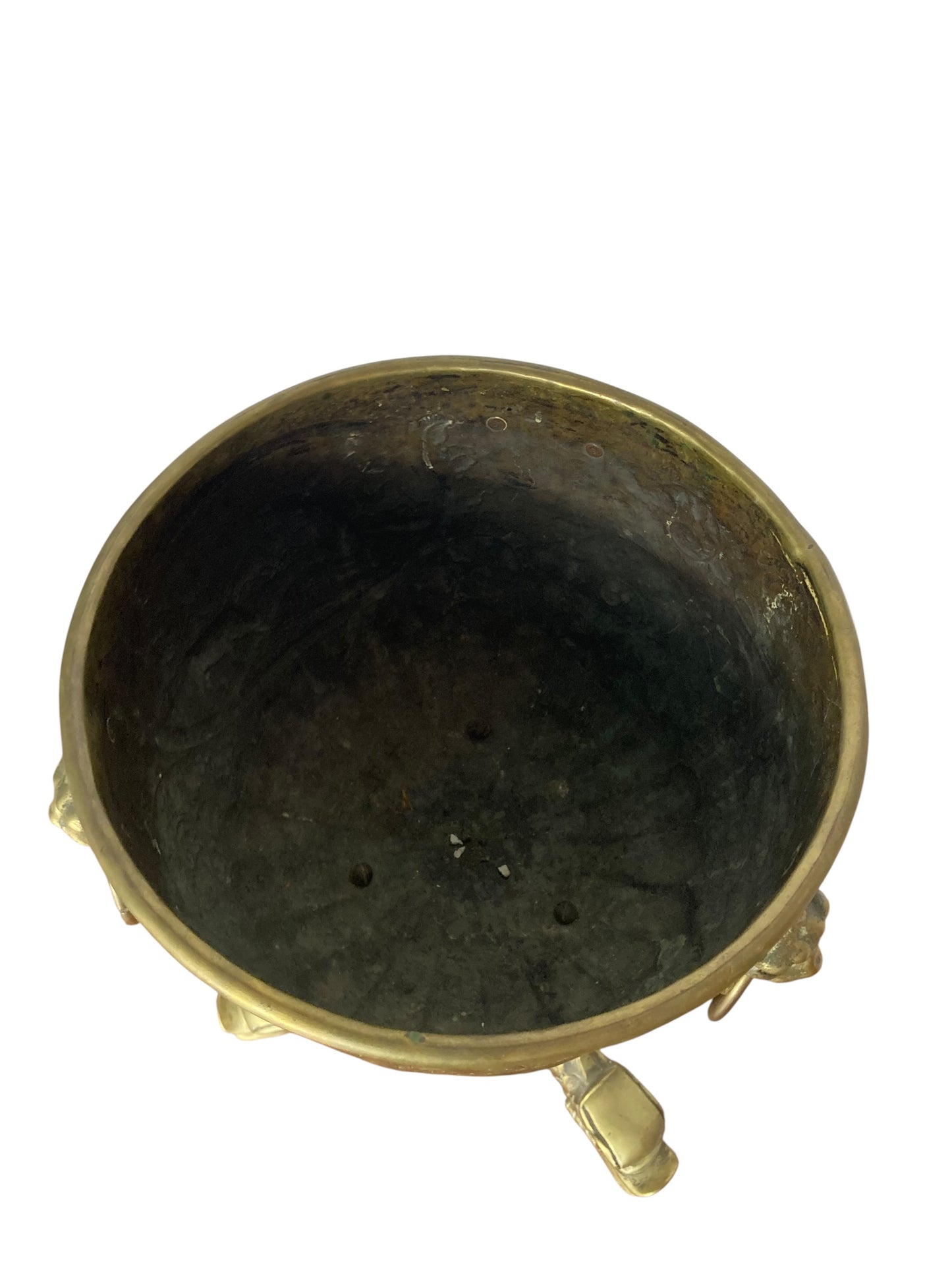 An antique brass jardinière or decorative planter