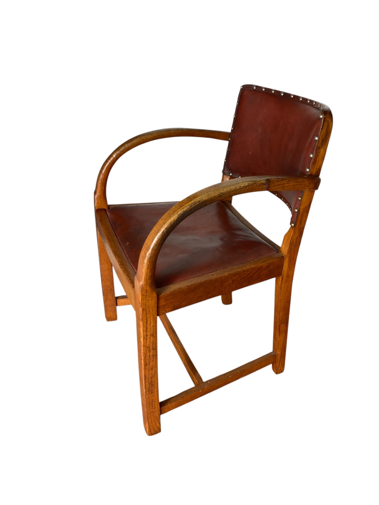 A vintage Art Deco-style armchair in the manner of Heals and Sons