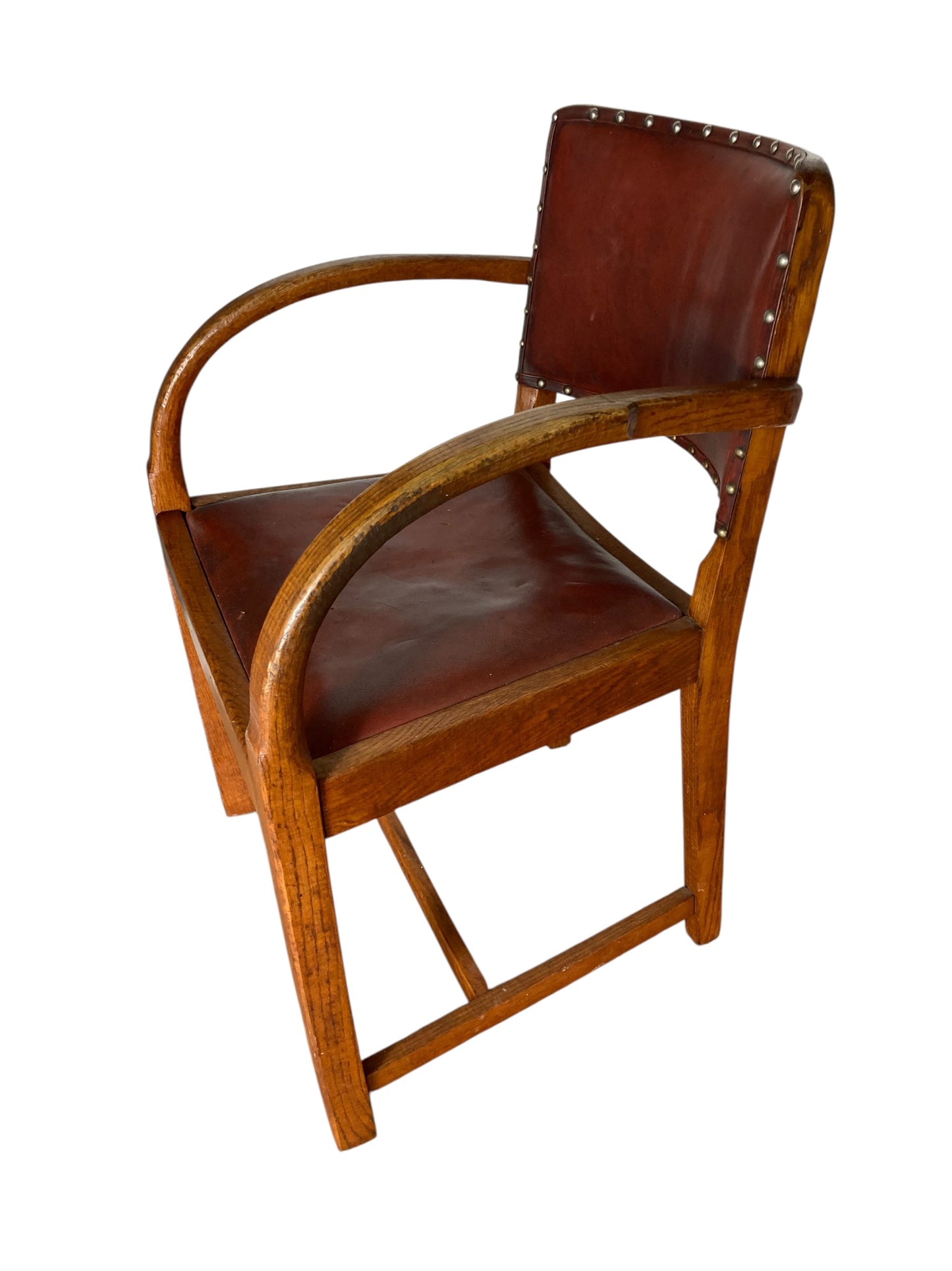 A vintage Art Deco-style armchair in the manner of Heals and Sons
