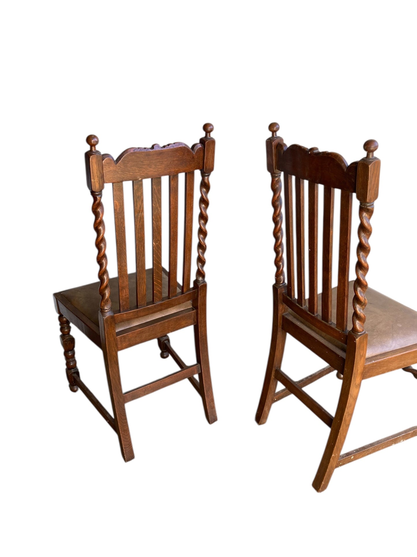 Pair of antique oak barley twist dining chairs dating from the late Victorian (c. 1880)to Edwardian (c. 1910–1920)eras.
