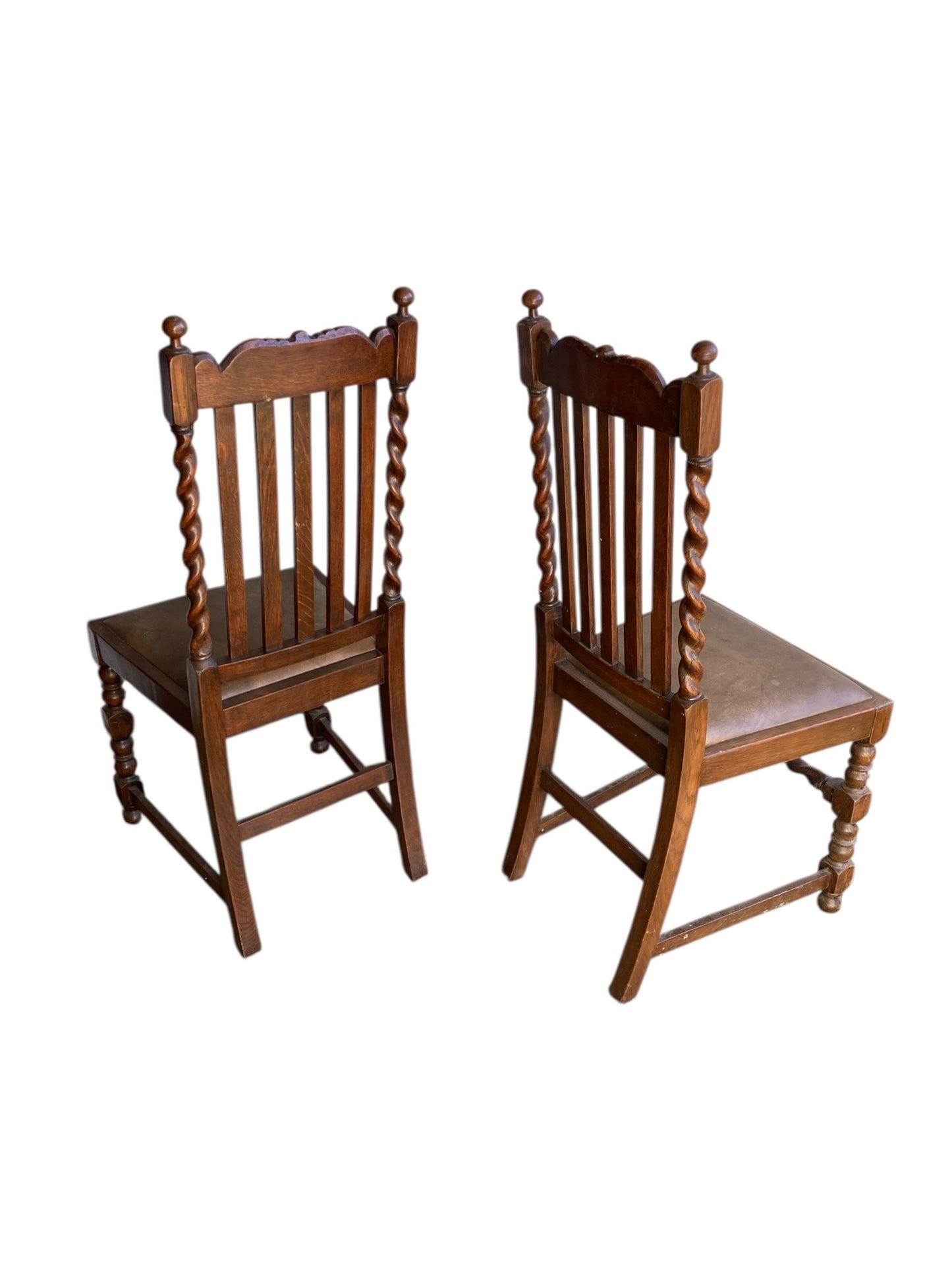 Pair of antique oak barley twist dining chairs dating from the late Victorian (c. 1880)to Edwardian (c. 1910–1920)eras.