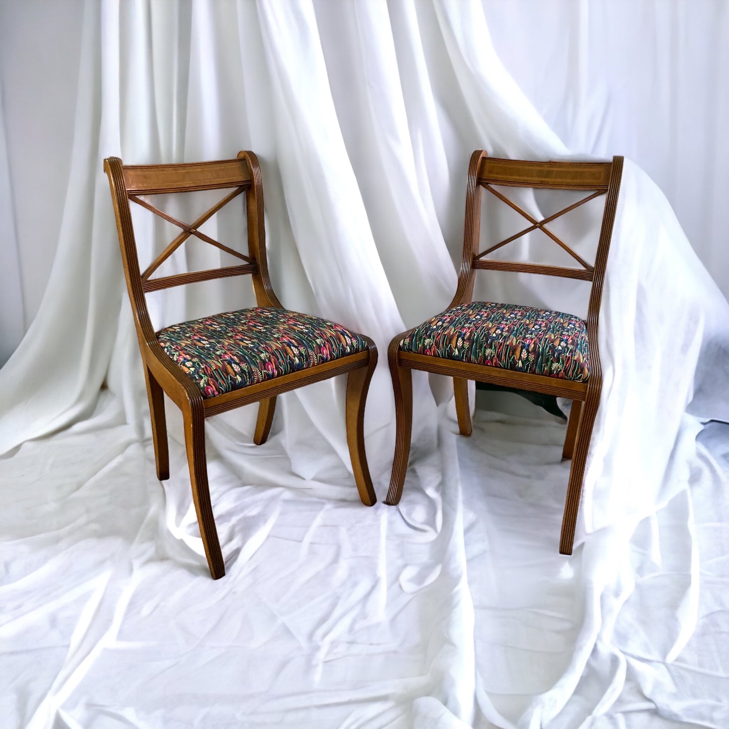 A pair of Regency Cross Stick Chairs