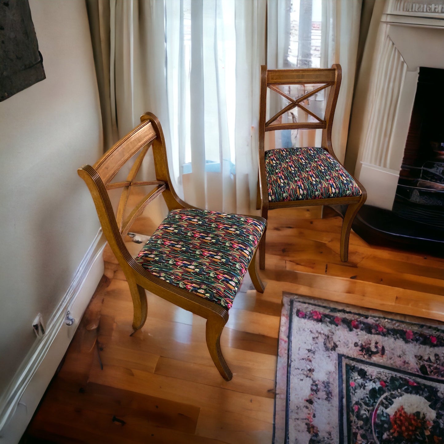 A pair of Regency Cross Stick Chairs