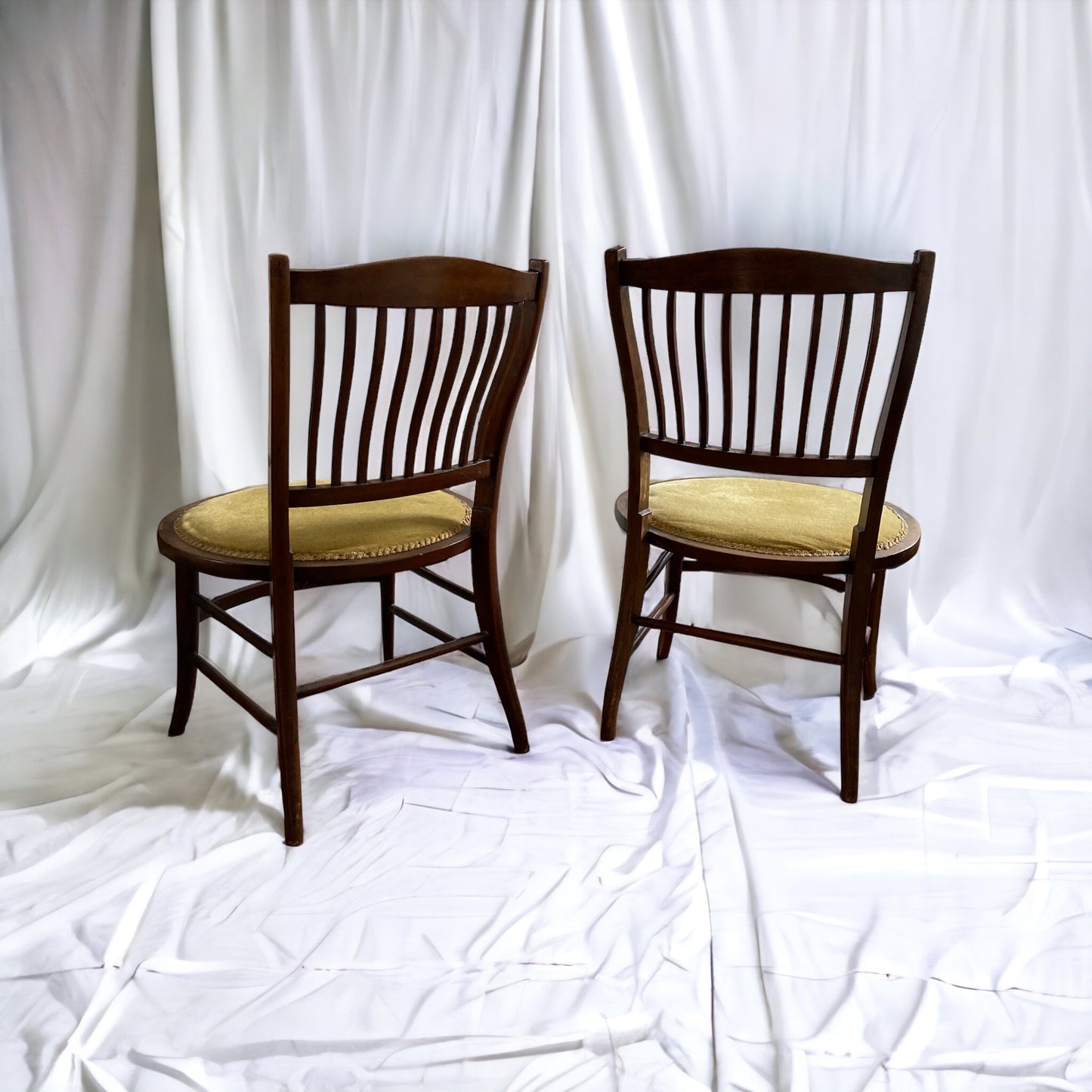 A pair of Edwardian Antique Mahogany Oval based hall chairs