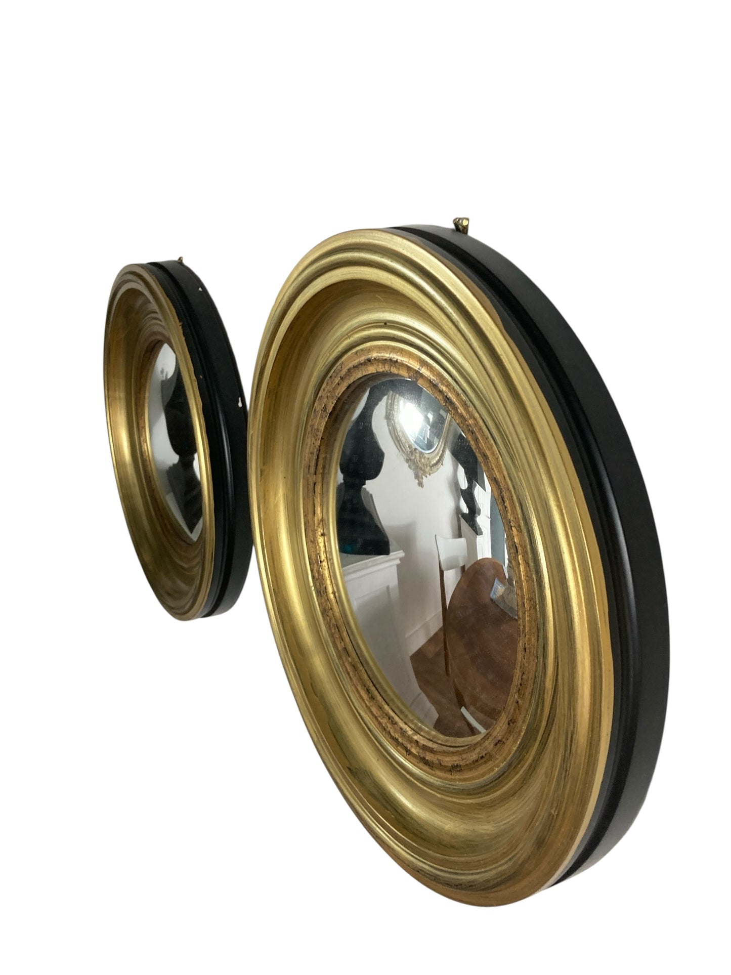 A Pair of Modern Regency Style Gold Circular Convex Mirrors with ebonsied Rim