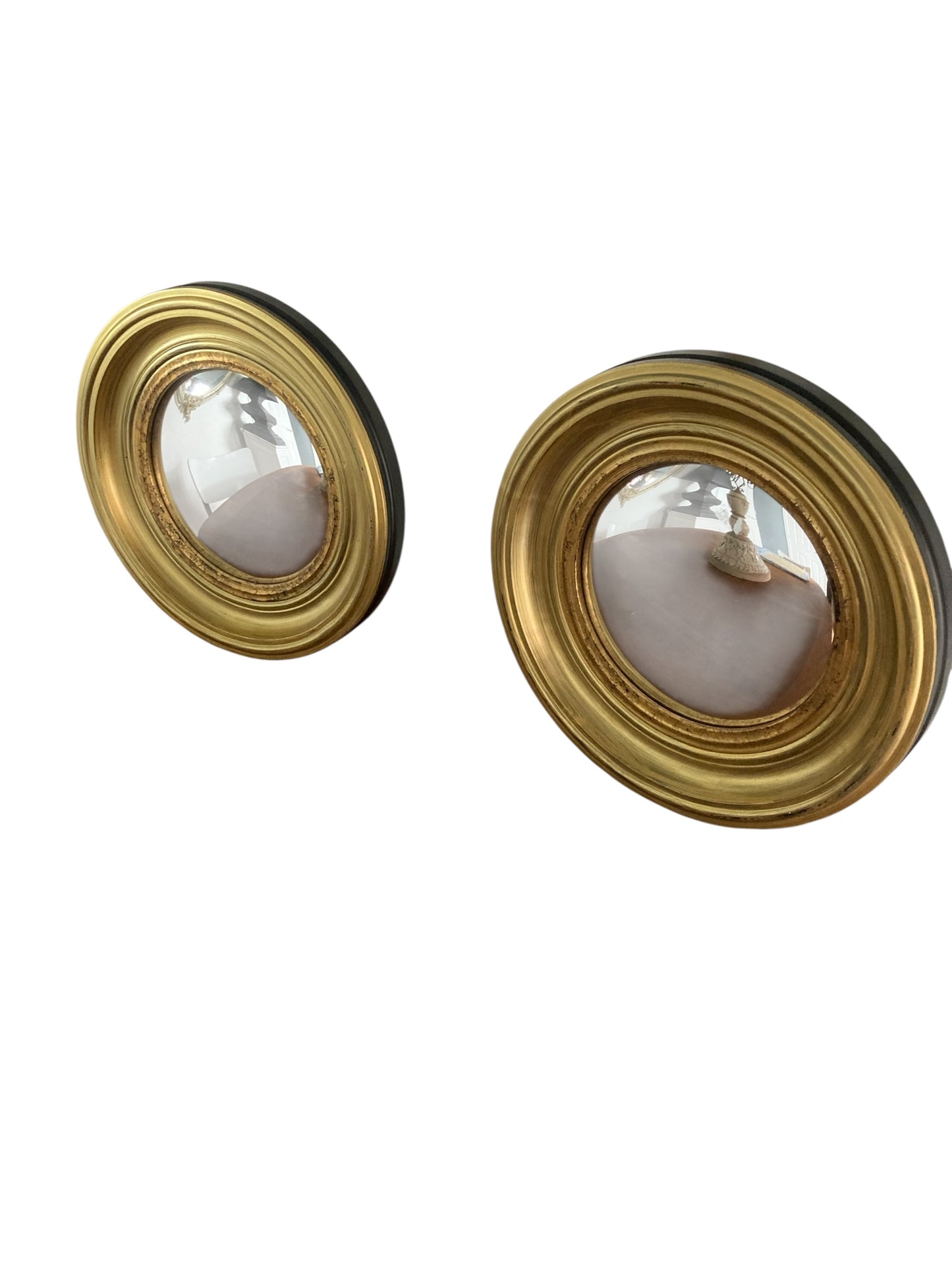 A Pair of Modern Regency Style Gold Circular Convex Mirrors with ebonsied Rim