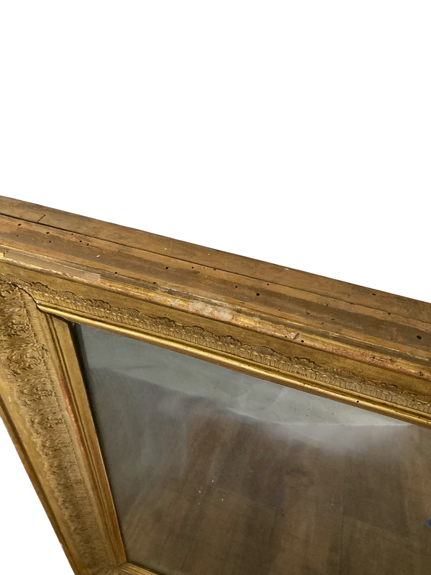 Victorian gilt wall mirror the frame decorated with moulded gold foliate patterns