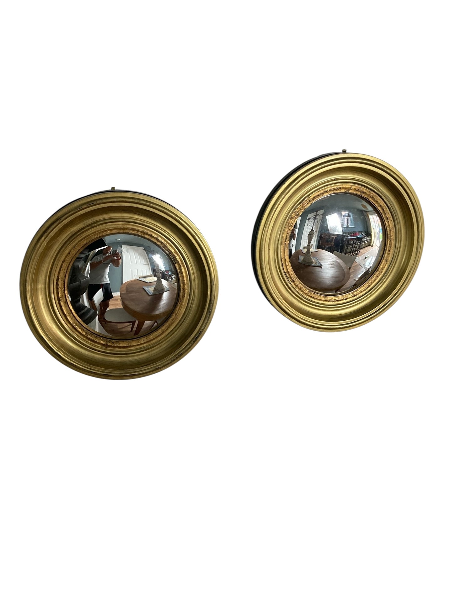 A Pair of Modern Regency Style Gold Circular Convex Mirrors with ebonsied Rim