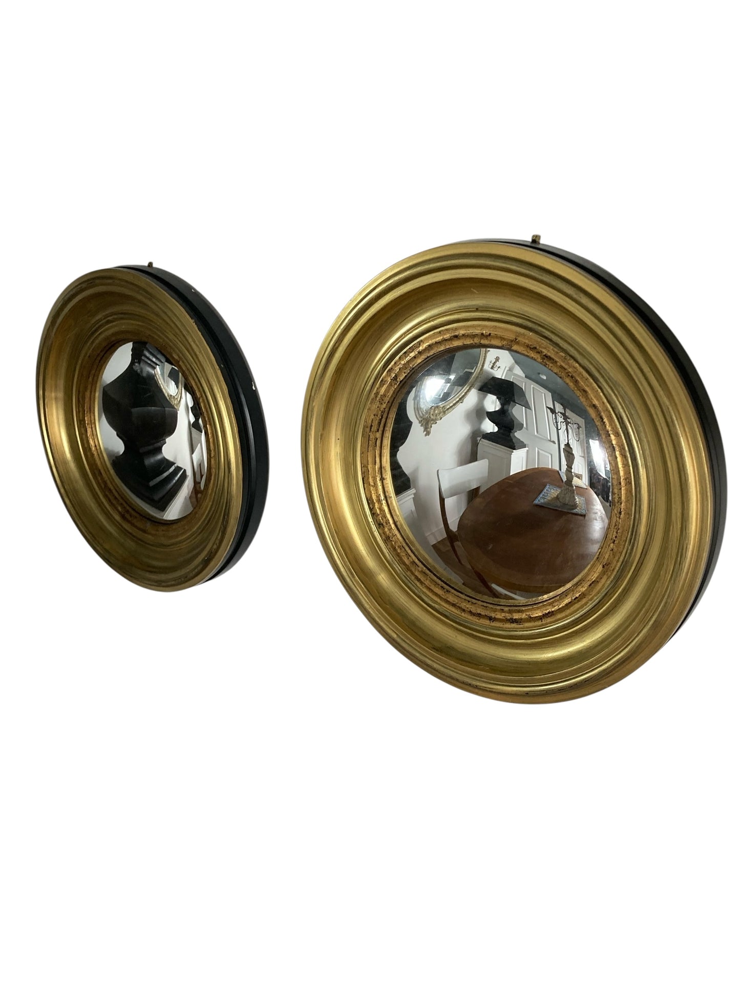 A Pair of Modern Regency Style Gold Circular Convex Mirrors with ebonsied Rim