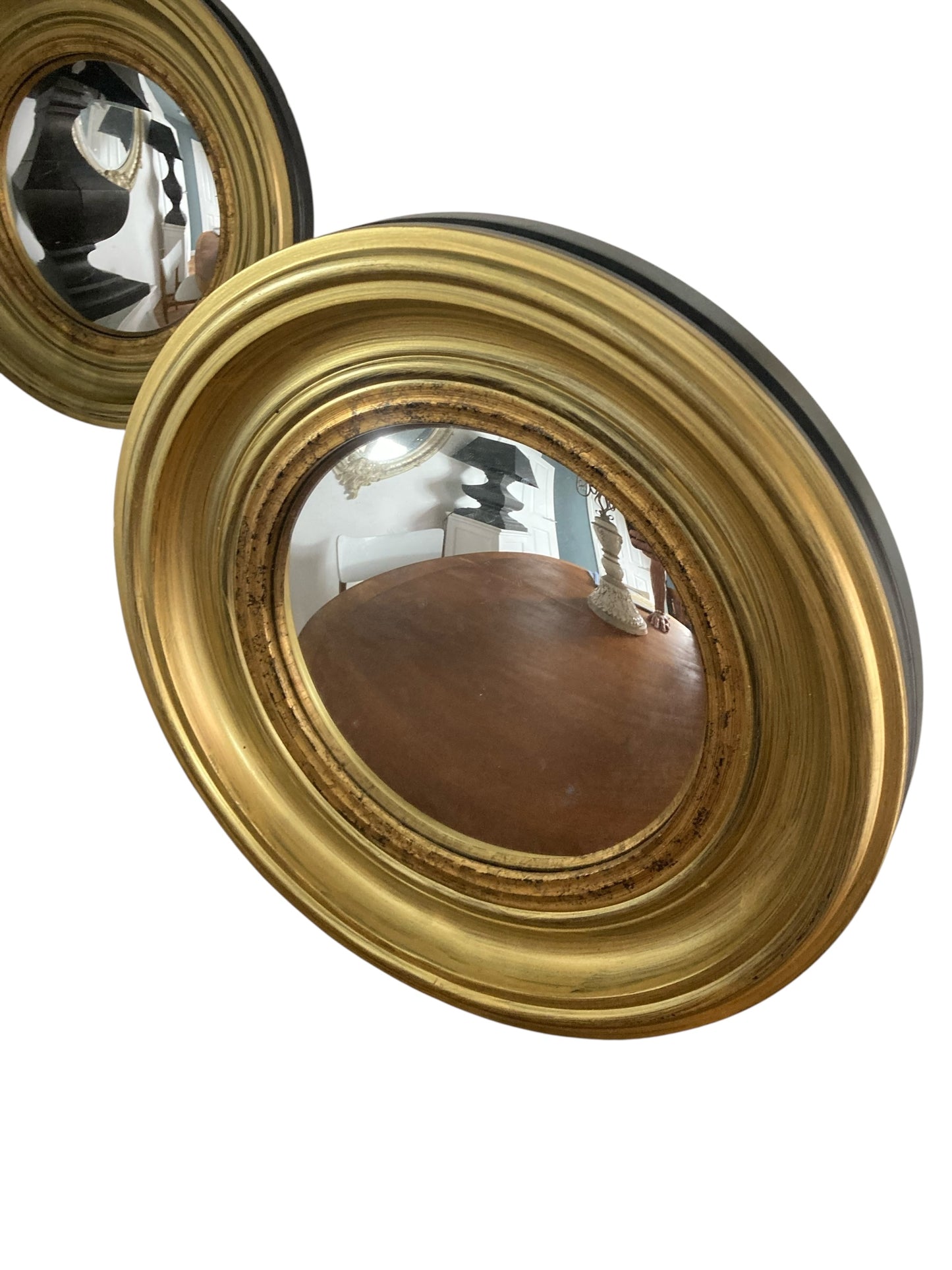 A Pair of Modern Regency Style Gold Circular Convex Mirrors with ebonsied Rim