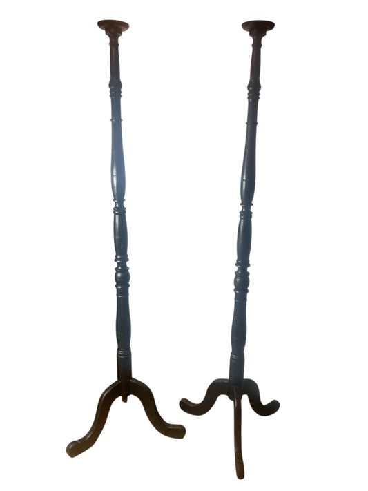 A pair of Tall Ebonised Tri Leg Torcheres