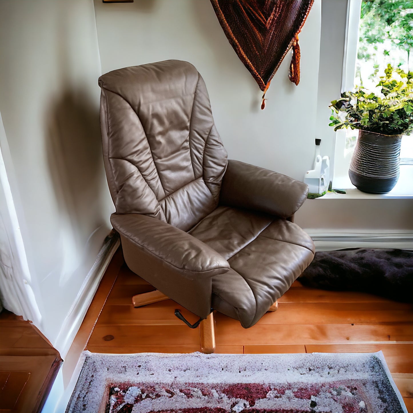 Danish style vintage swivel chair, upholstered in in Dark Brown Faux leather, 1970s.