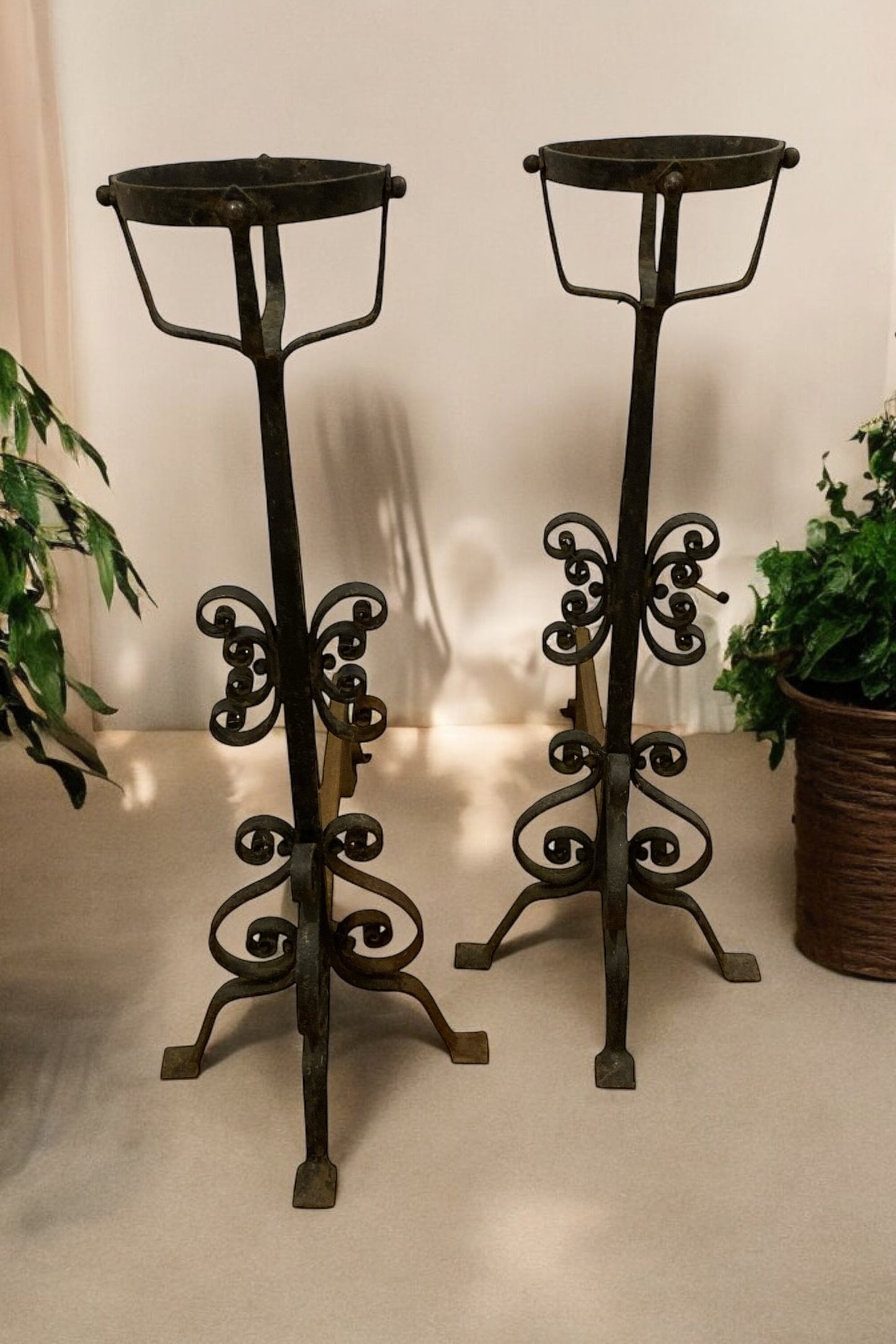 A pair of Large French Wrought Iron Fire Dogs with large fire baskets