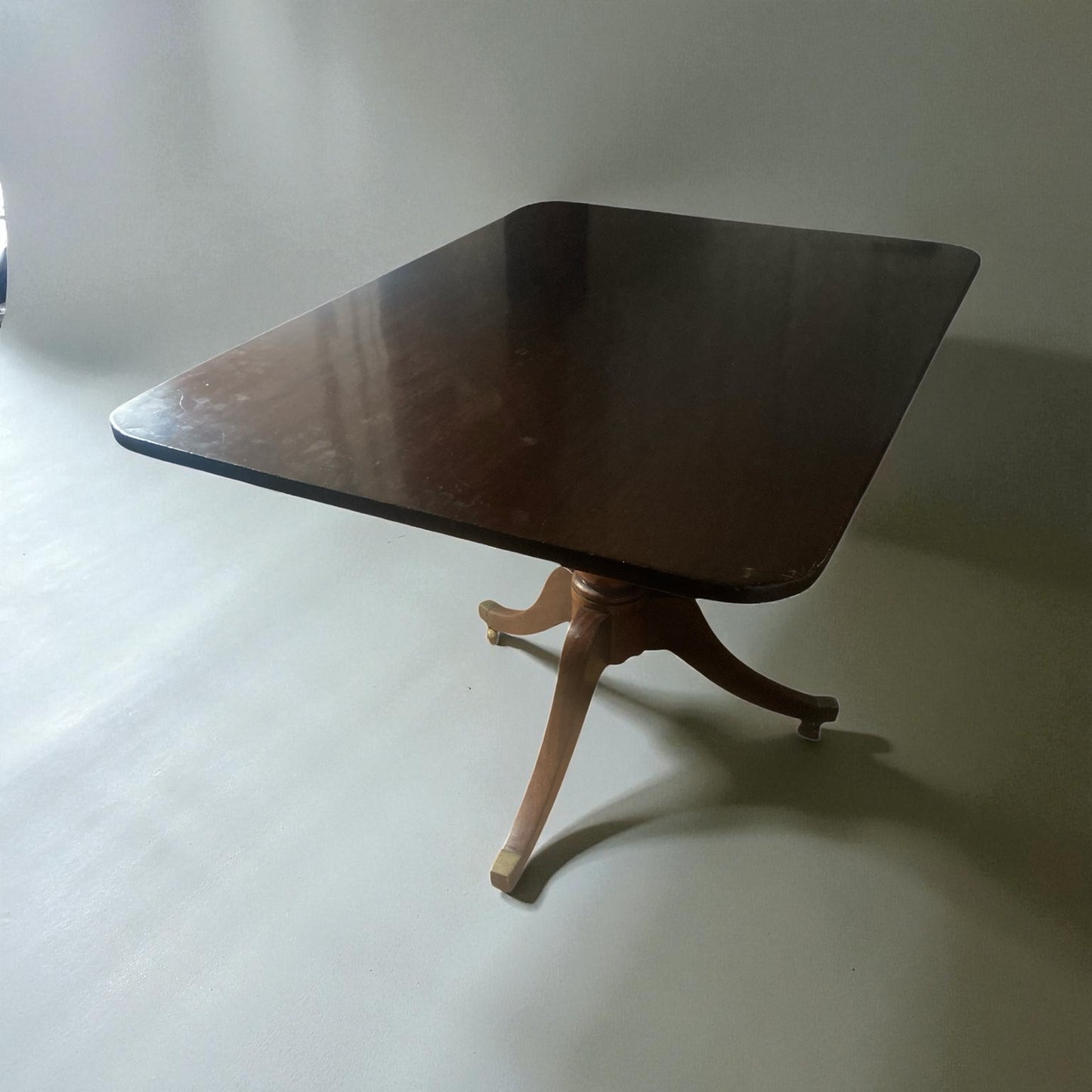 Georgian mahogany Tilt top table on brass castors