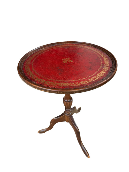 Antique-style tripod pedestal wine table featuring a circular top with a distinctive red leather inset.