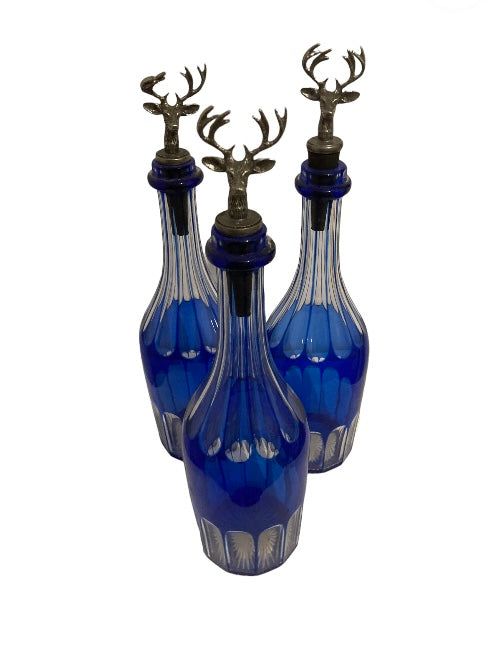 Three Ornate Blue Sprit Bottles